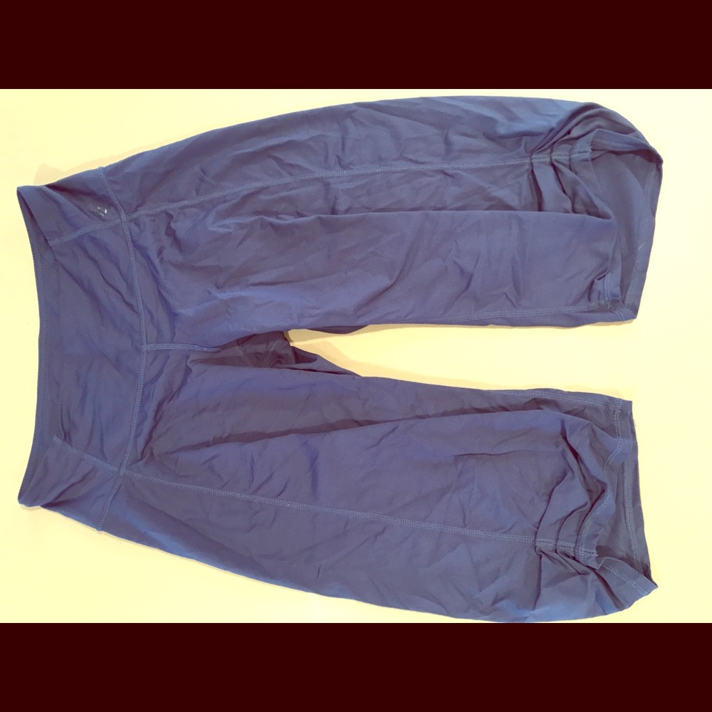 Navy blue silky Lululemon workout bottoms.